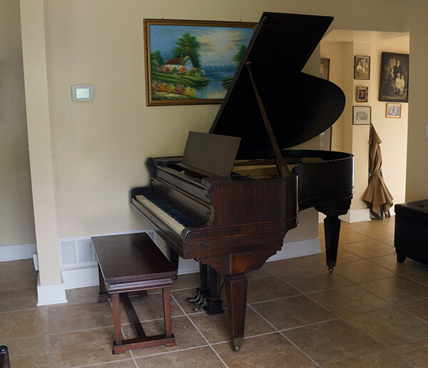 | Piano Movers Extraordinaire, Inc. piano in home after piano movers helped relocate it